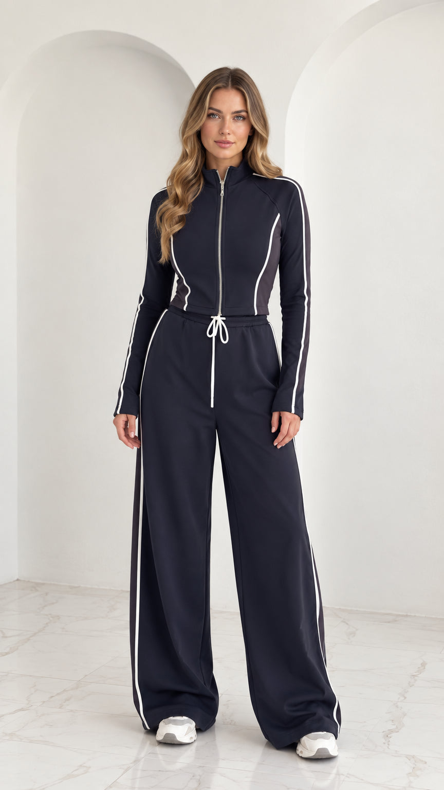 Full front view of model wearing Navy Blue 2-piece zip-up tracksuit set with white contrast piping