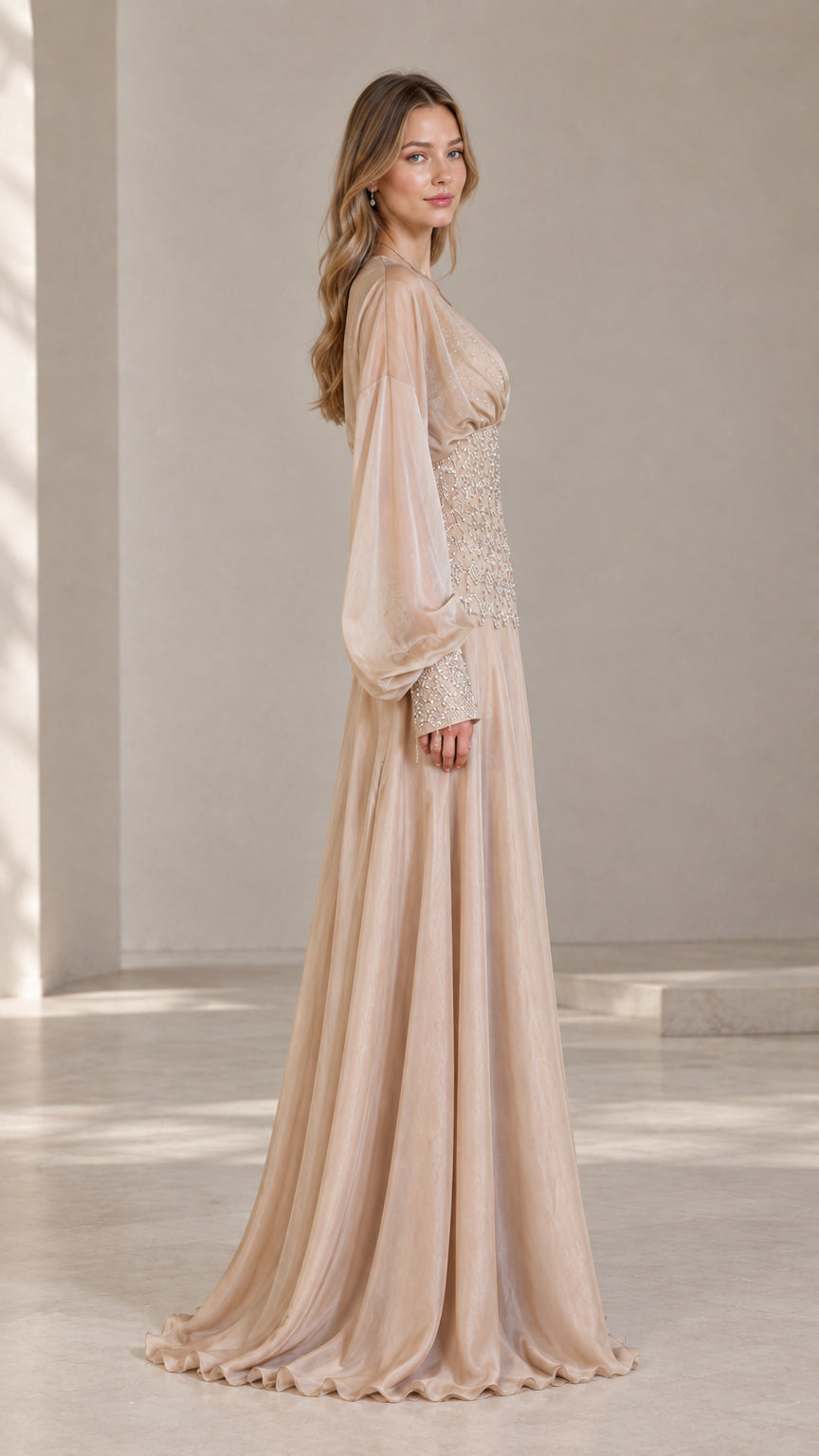 Side profile view of champagne evening gown with draped bishop sleeves