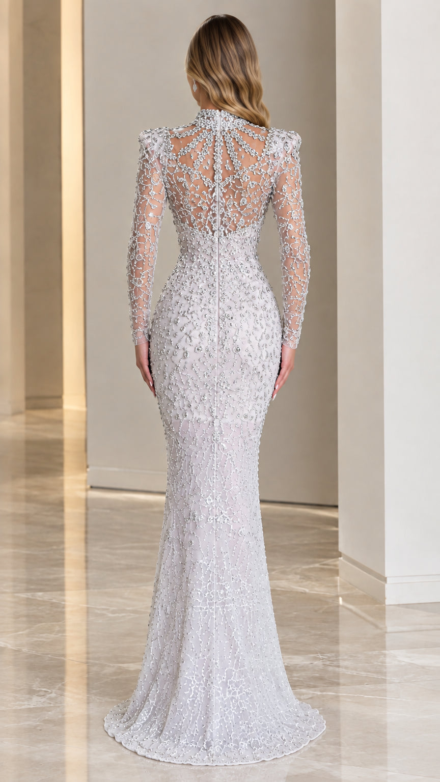 Back view of Silver long sleeve embellished mermaid gown