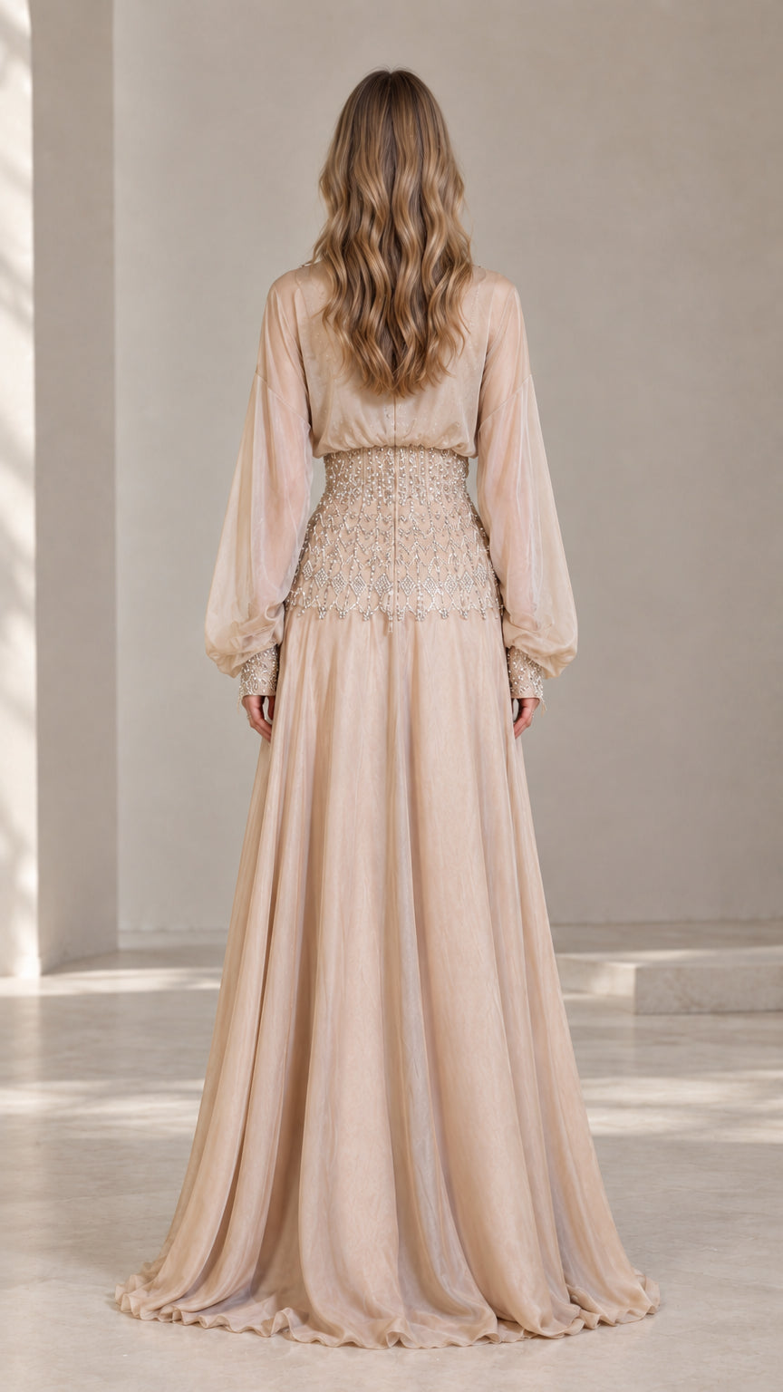 Back view of champagne floor-length formal gown with cinched waist