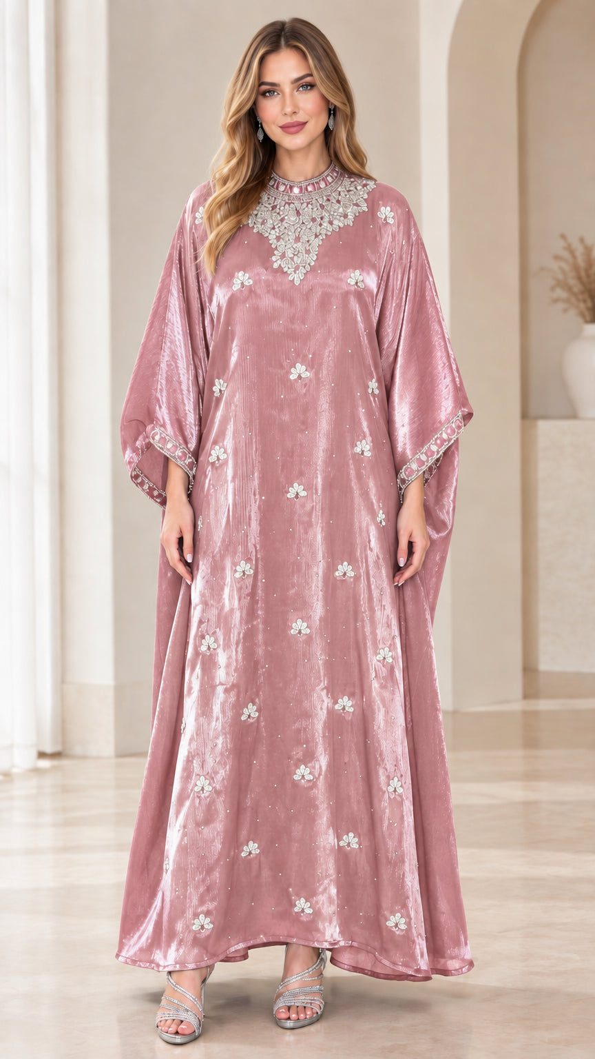 Model wearing rose pink velvet kaftan maxi dress with sparkling crystal accents