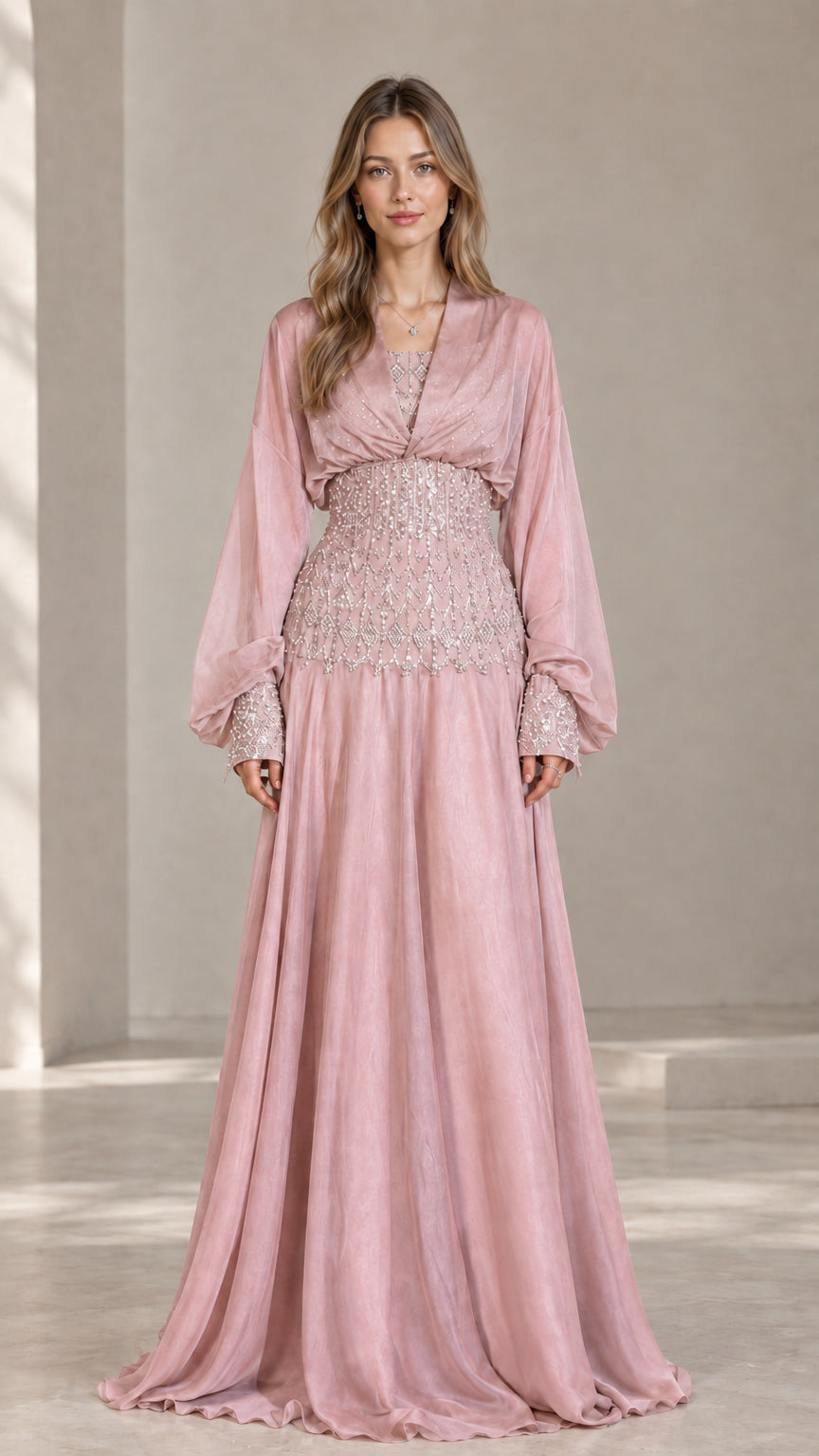 Blush pink formal maxi dress with embellished waist and flowing skirt