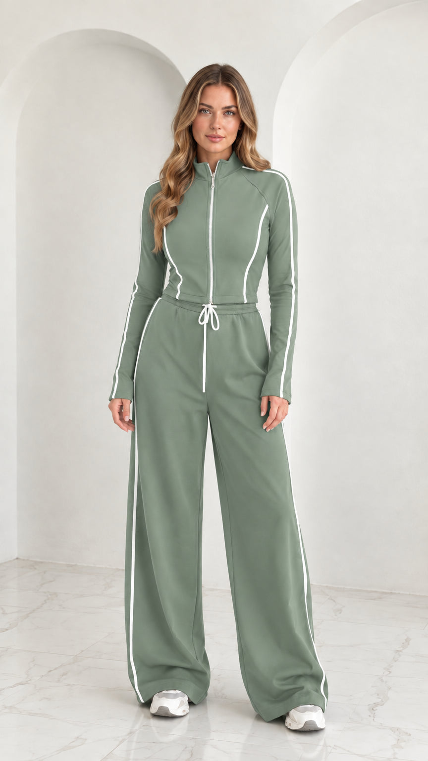 Full front view of model wearing Sage Green 2-piece zip-up tracksuit set with white piping